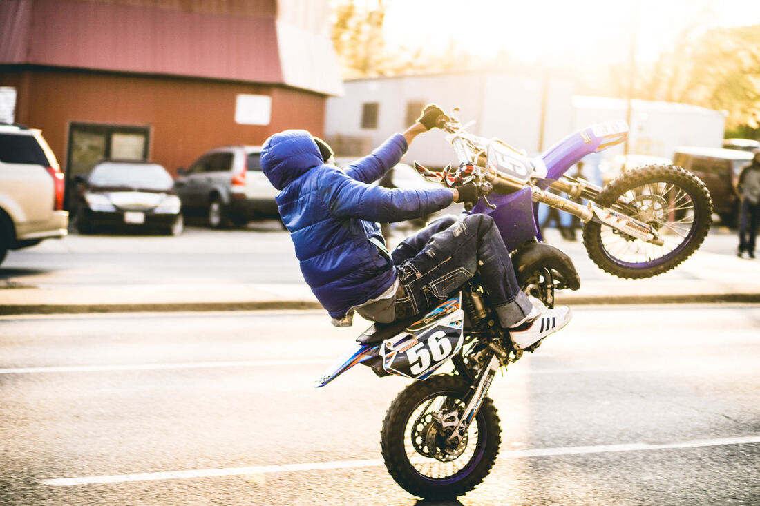 Rider pulling a wheelie
